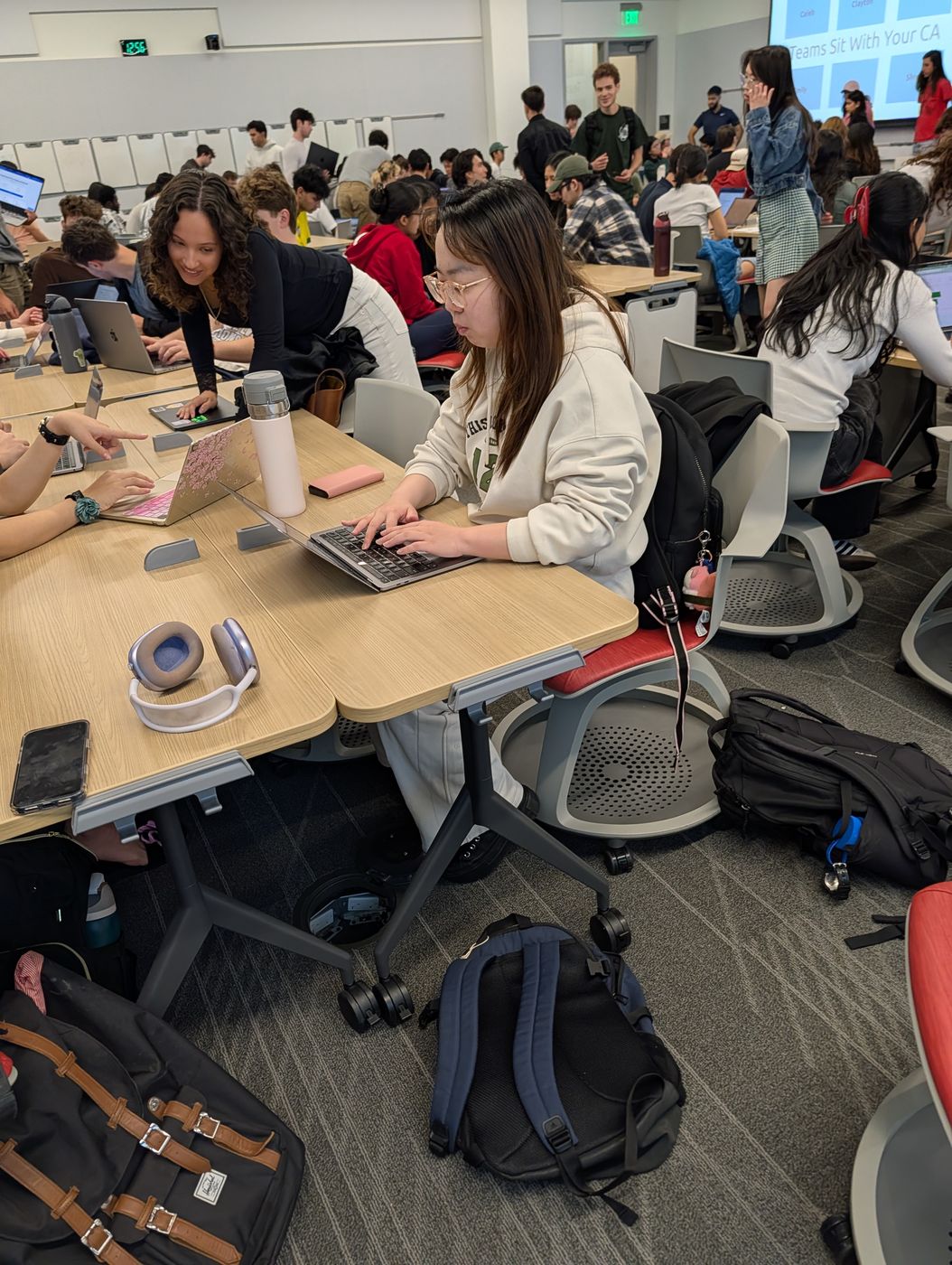 Students presenting and collaborating at a Stanford software event